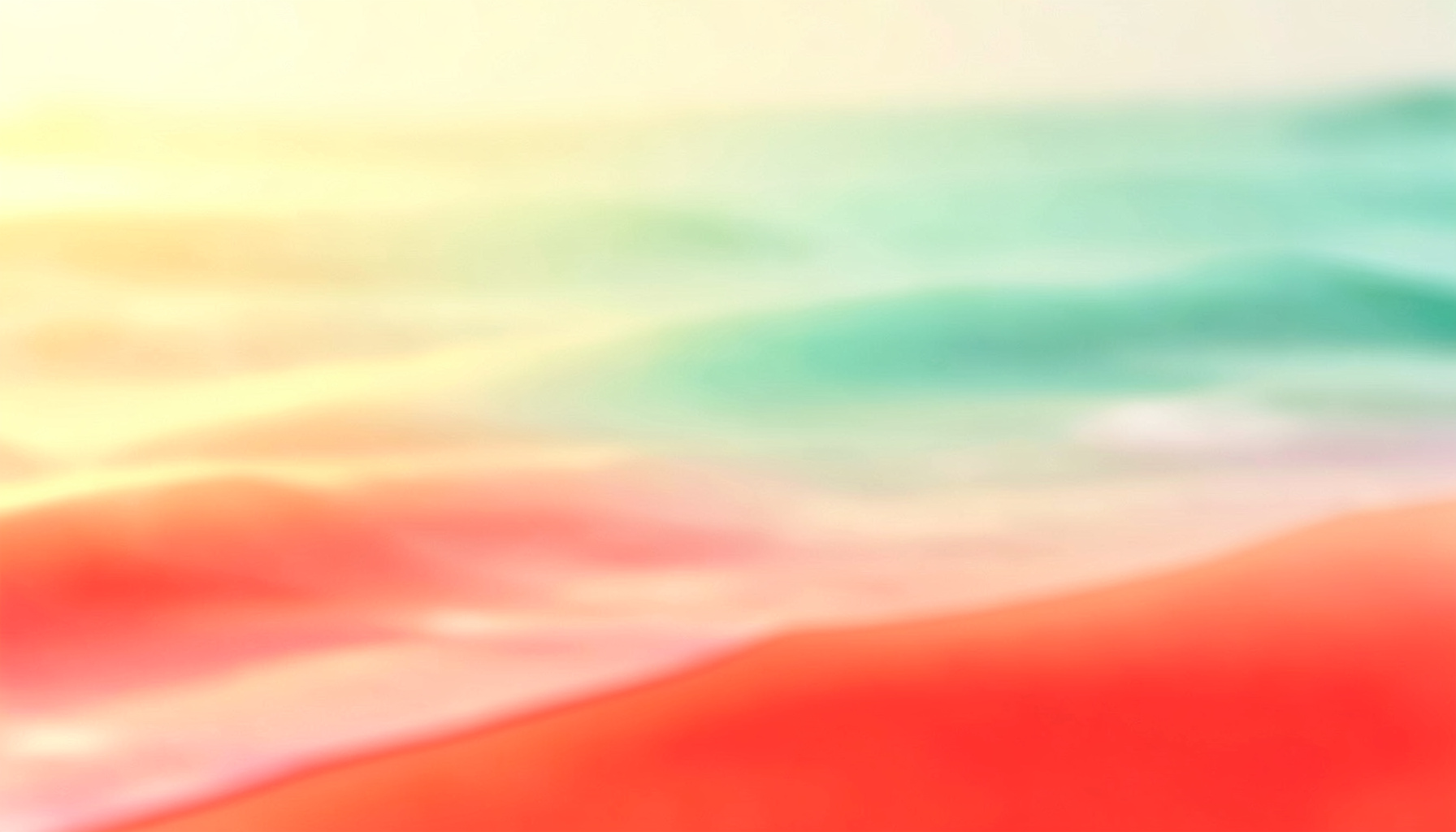 A sunlit shoreline with soft waves lapping at pale sand, warm golden and turquoise tones blending into a hazy horizon