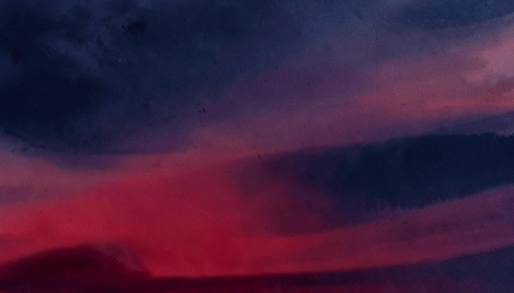 A dusky abstract wash of deep indigo and muted coral, suggesting twilight over the ocean